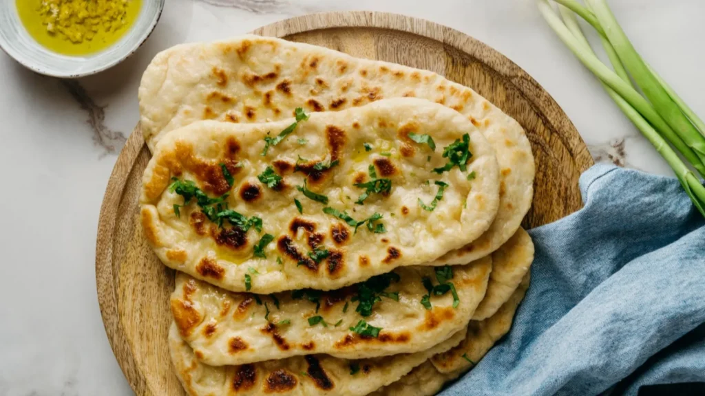 Soft and fluffy Naan Bread, the ideal accompaniment to curries, freshly prepared at Calamari Kitchen & Bar.